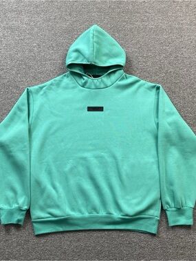Essentials Mint Green Pullover with Black Chest Patch